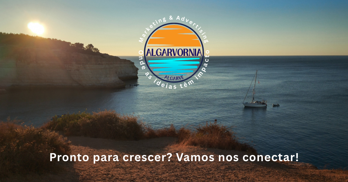 sailboat in ocean in front of cliffs