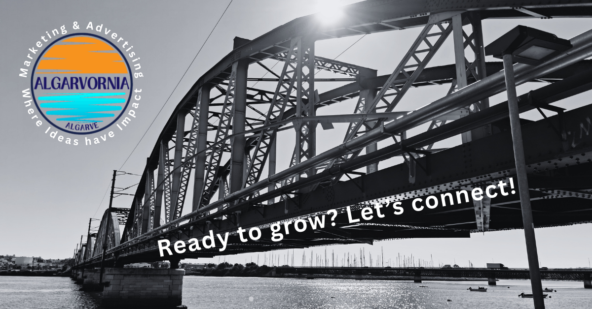 railway bridge crossing a river in black and white