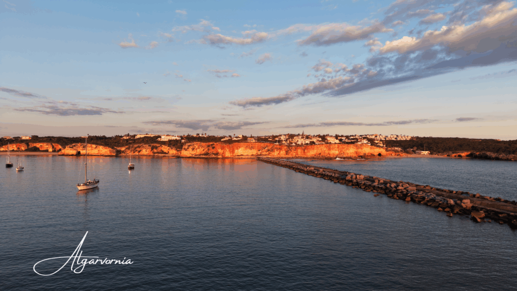 Algarvornia Benagil Cave tickets and marketing, ocean with cliffs and a lighthouse on top